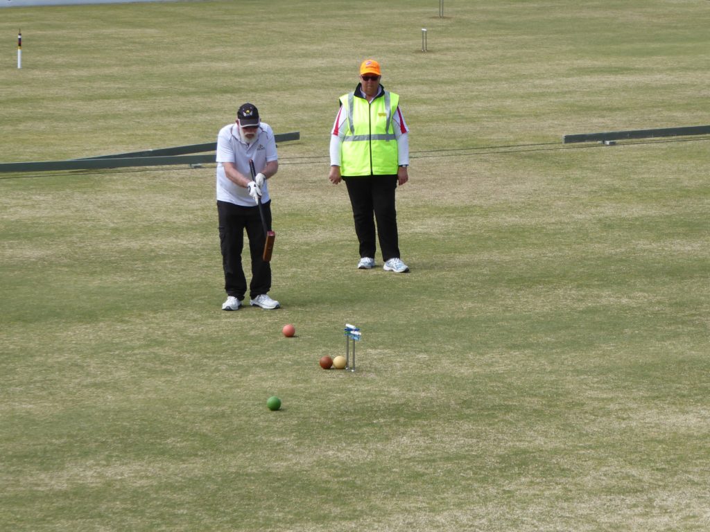 WA player John Doepel under the watchful eye of South Australian referee Ann Woodhouse